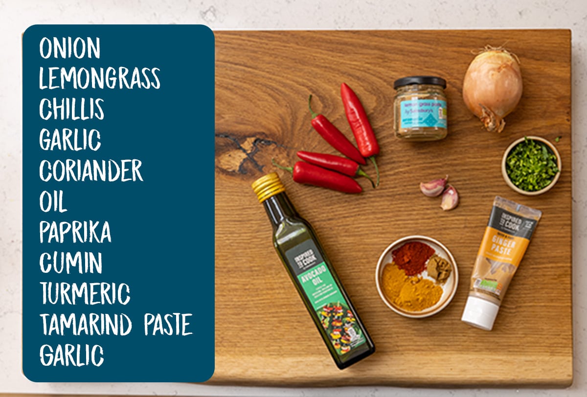 Ingredients for laksa paste on a wooden board