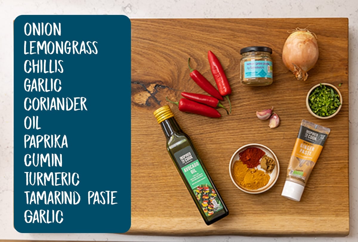 Ingredients for laksa paste on a wooden board