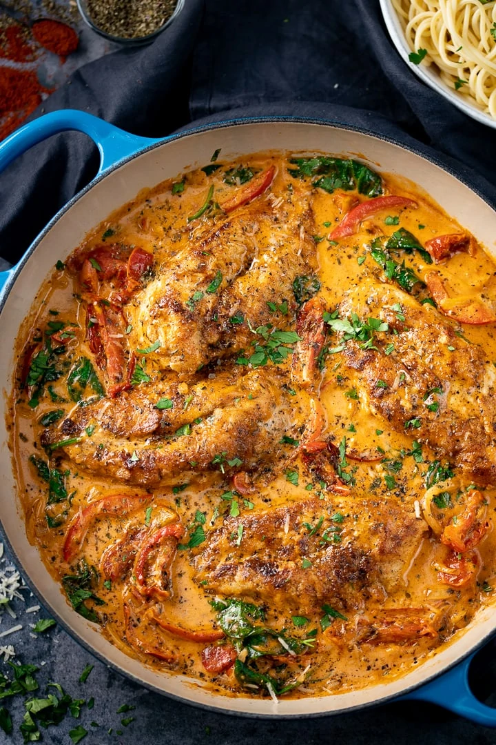 Creamy Tuscan Chicken in a blue pan