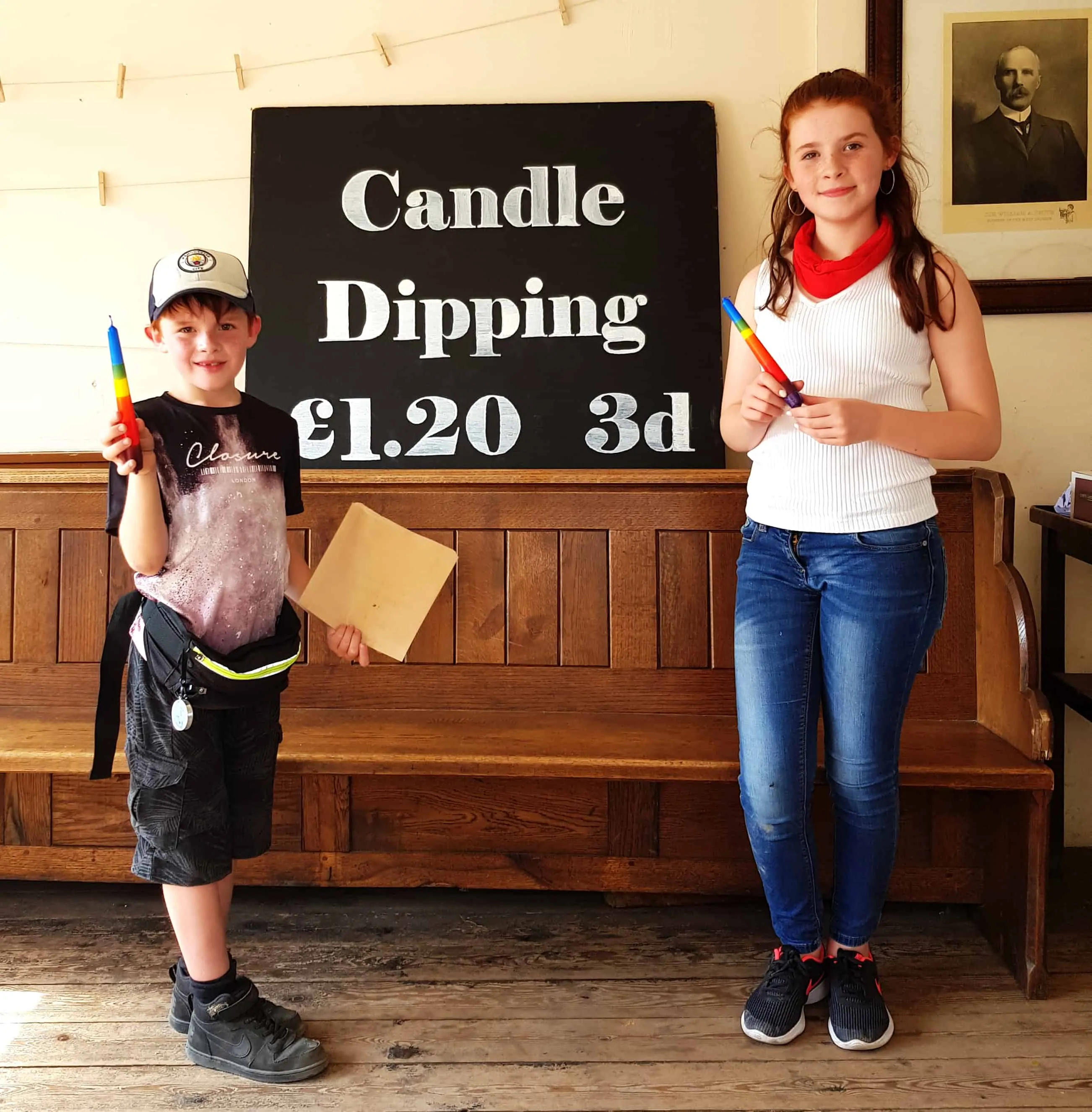Kids showing their candles after candle dipping