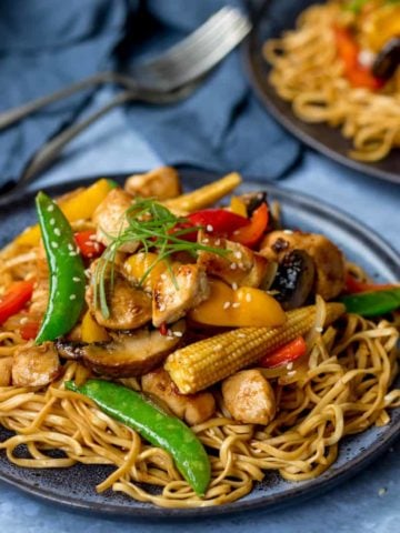 Plate of honey and soy chicken stir fry with noodles
