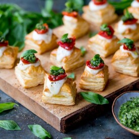 Puff pastry caprese bites on a serving board