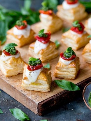Puff pastry caprese bites on a serving board