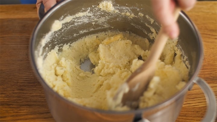 Stirring a pan of mashed potatoes