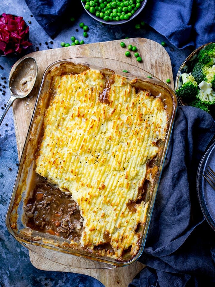 Dish of cottage pie with scoop taken out