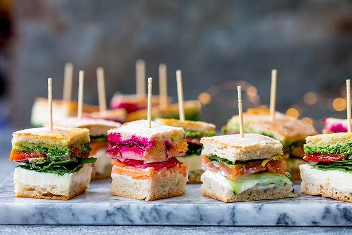Wide image of mini sandwich bites with different fillings