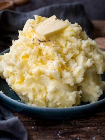 Pile of mashed potatoes with butter on top