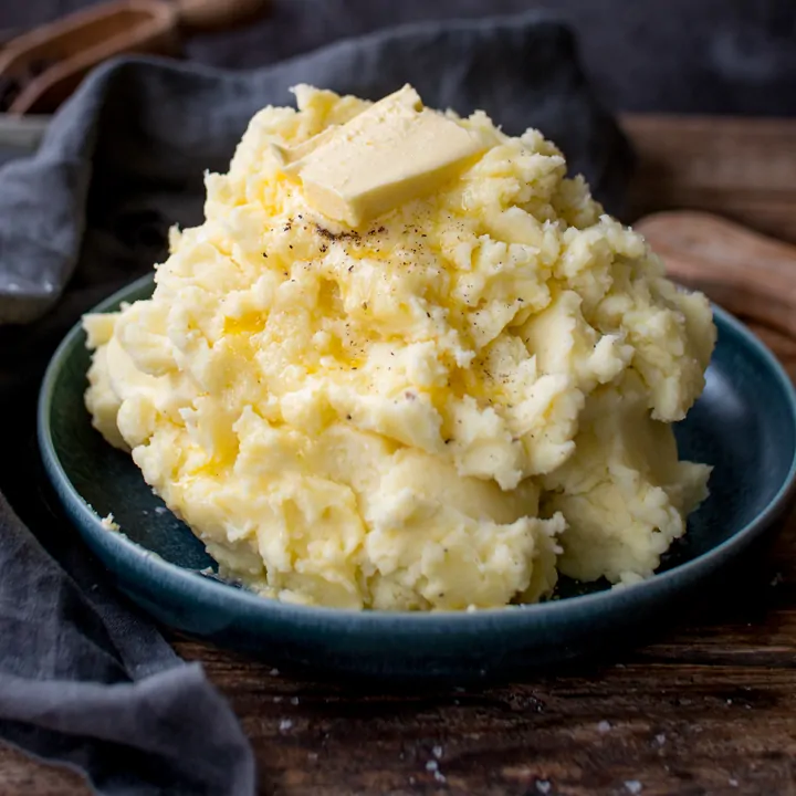 Pile of mashed potatoes with butter on top