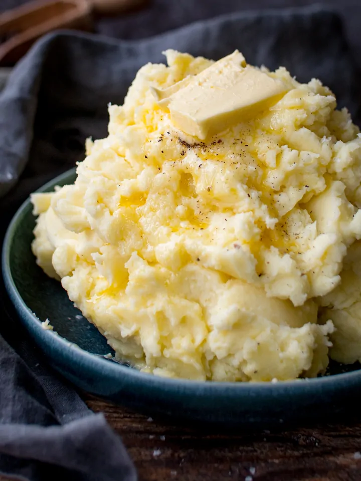 Close up of mashed potatoes with melting butter on top