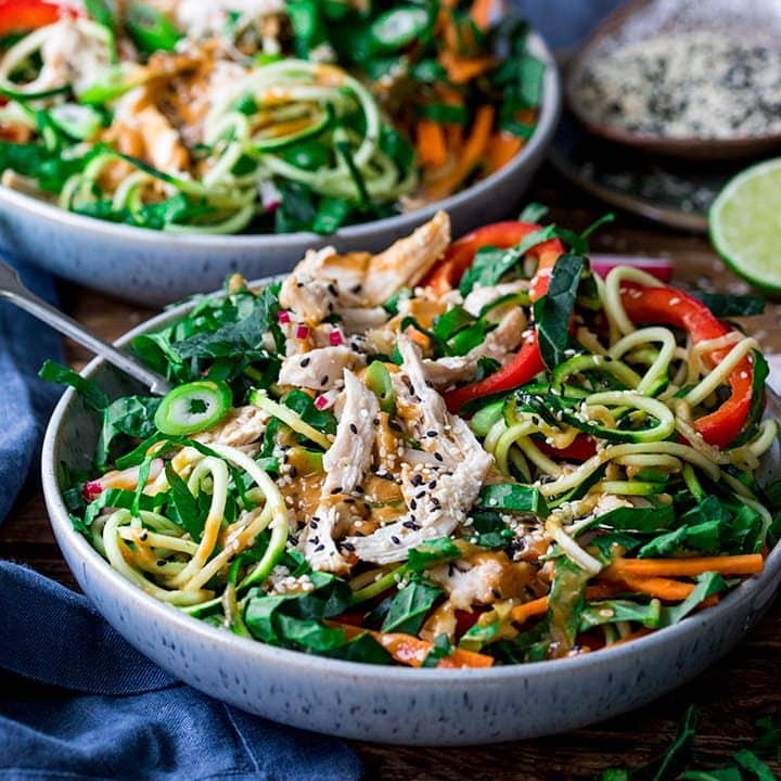 square image of chicken zoodle salad with Thai peanut sauce