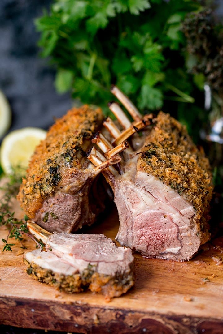 Herb crusted roasted rack of lamb with a slice taken out