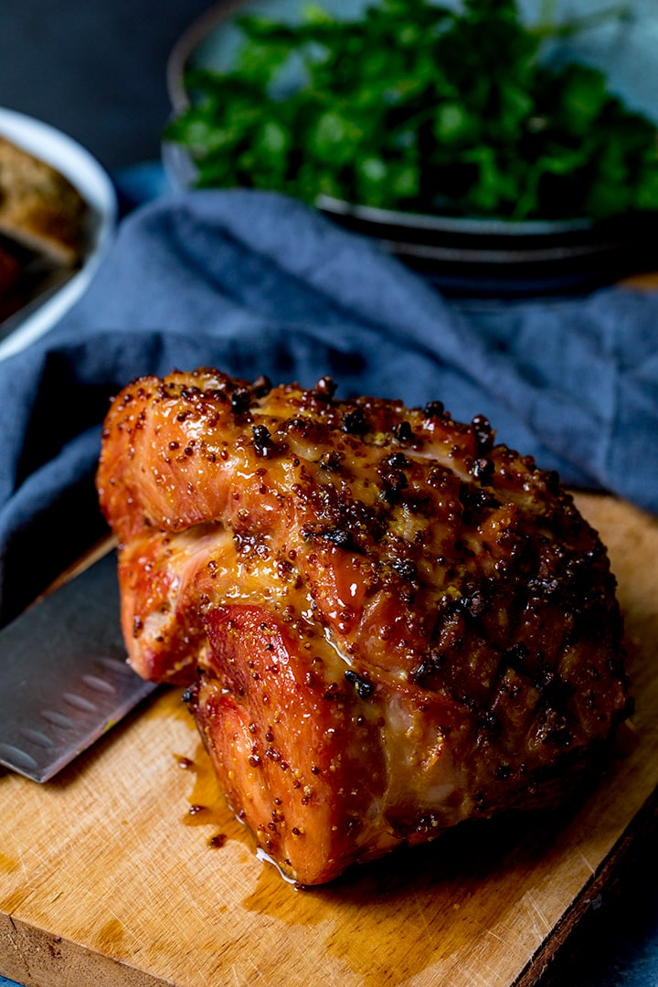 Baked Ham on a wooden chopping board