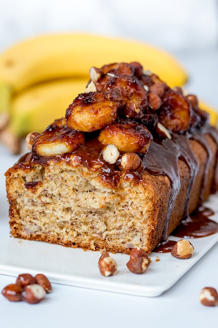 Banana bread with caramelized bananas with a slice taken out