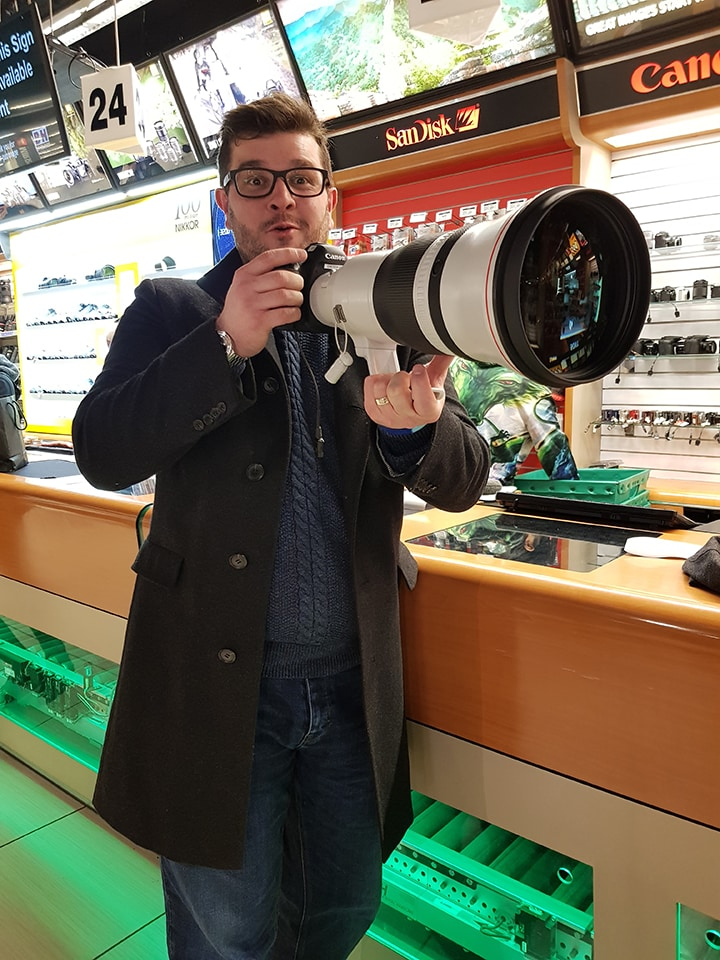 Chris trying out a huge lens in B and H in New York
