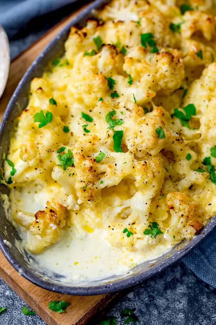 Cauliflower cheese with spoonful taken out