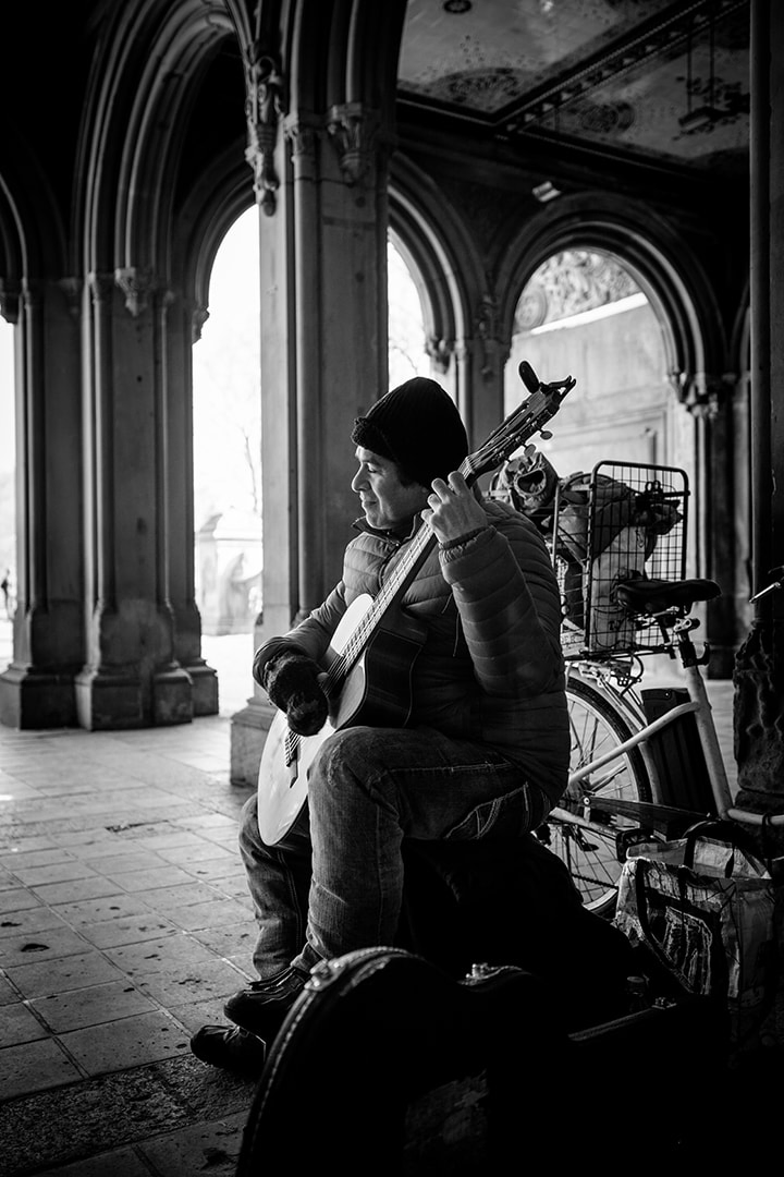 Black and white image of a central park busker