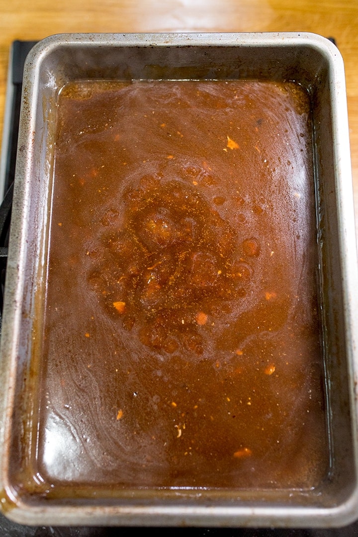 Gravy bubbling in roasting tin