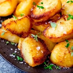 Roast potatoes with salt and fresh thyme leaves