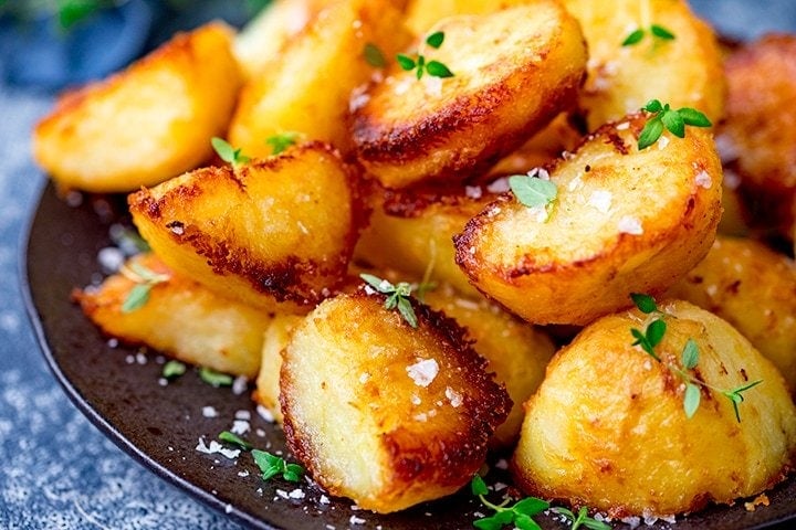 Roast potatoes with salt and fresh thyme leaves