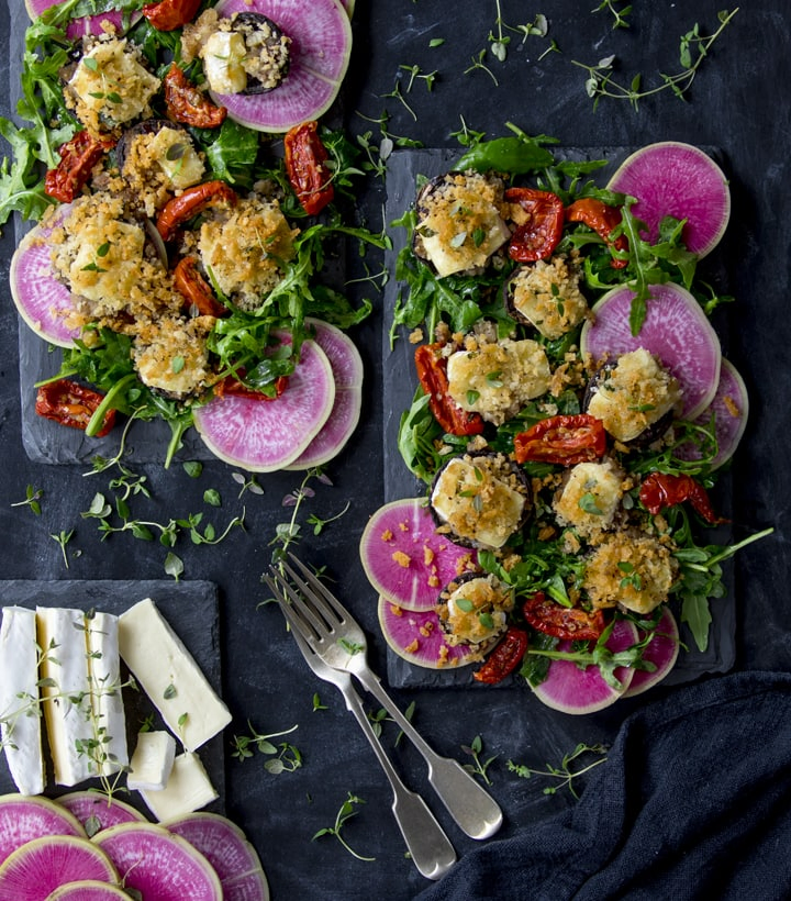 Overhead image of brie stuffed mushroom salad with watermelon radish slices and sun dried tomatoes
