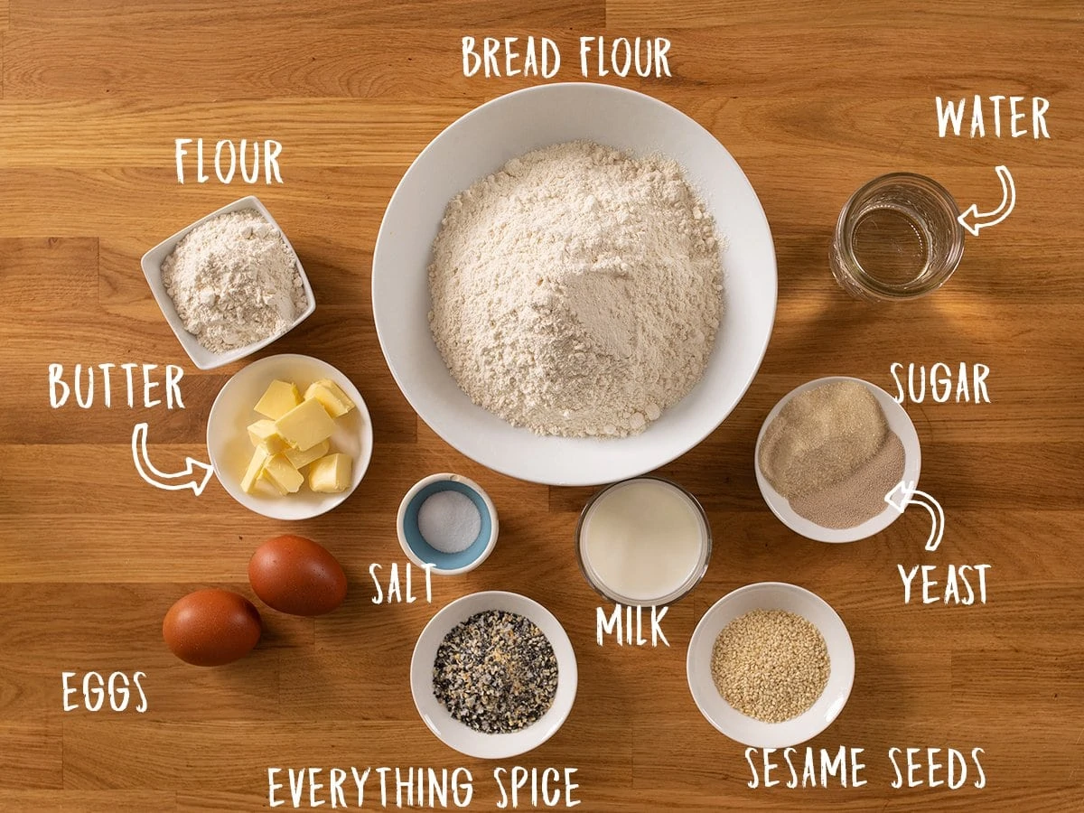 Ingredients for making brioche buns on a wooden table