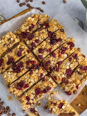 Overhead image of peanut butter, chocolate and cranberry granola bars chopped into slices