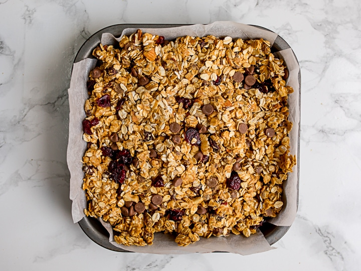 Granola bar mixture in a baking tin