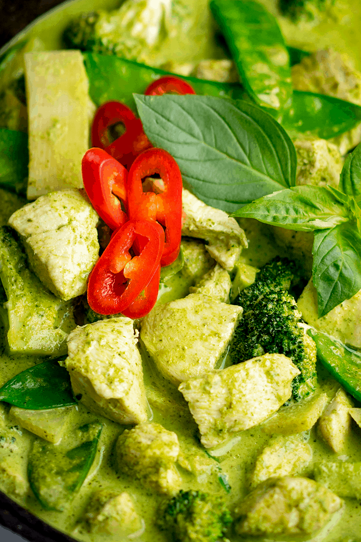 Close up of Thai green chicken curry with red chillies on top