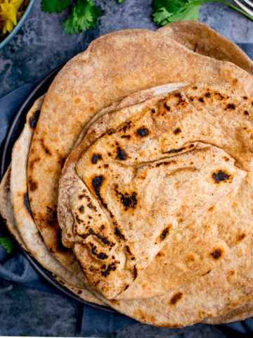 Stack of Chapati on a plate on blue background