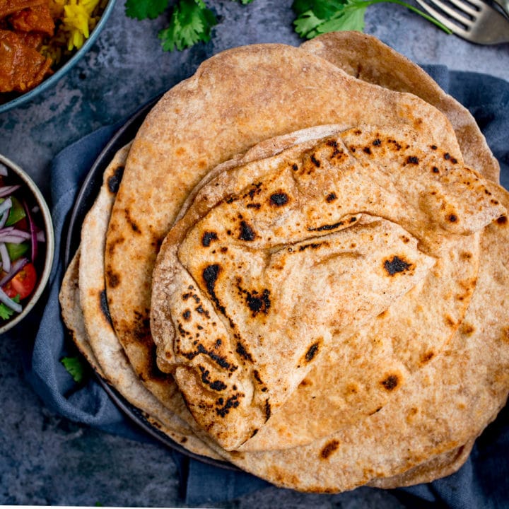 Stack of Chapati on a plate on blue background