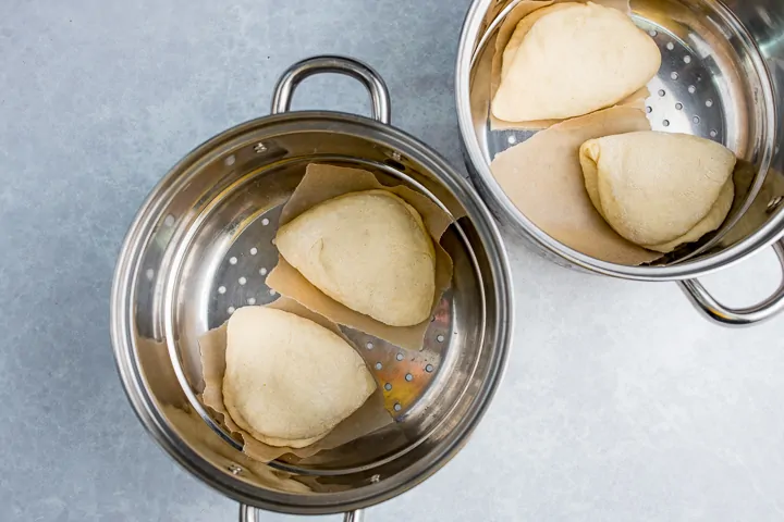 Bao buns in a steam pan ready to be steamed