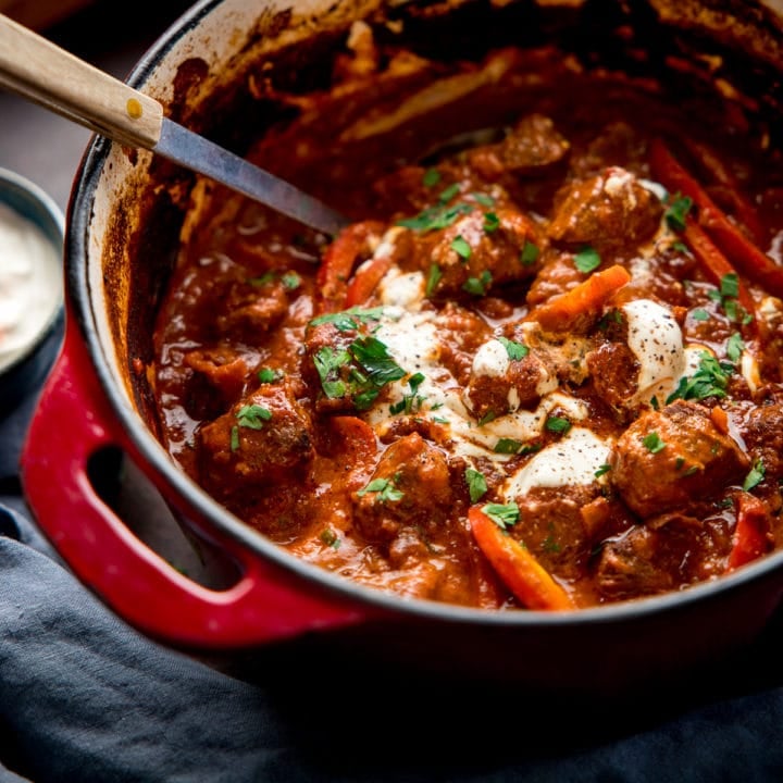 Square image of beef goulash in a Dutch Oven pan