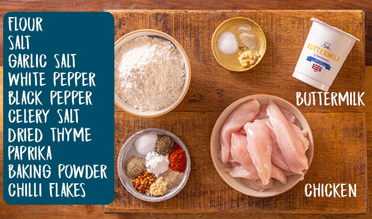 Ingredients for crispy chicken for chicken burger on a wooden table