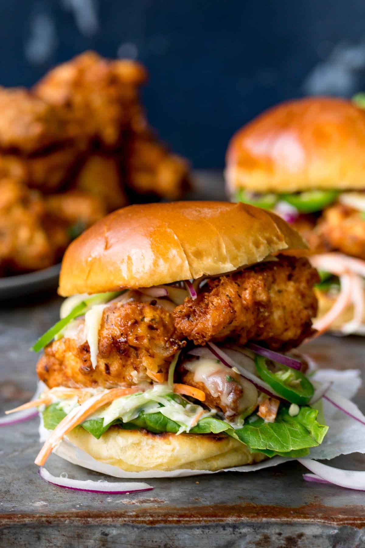 Crispy chicken burger on a brioche bun with lettuce and homemade coleslaw