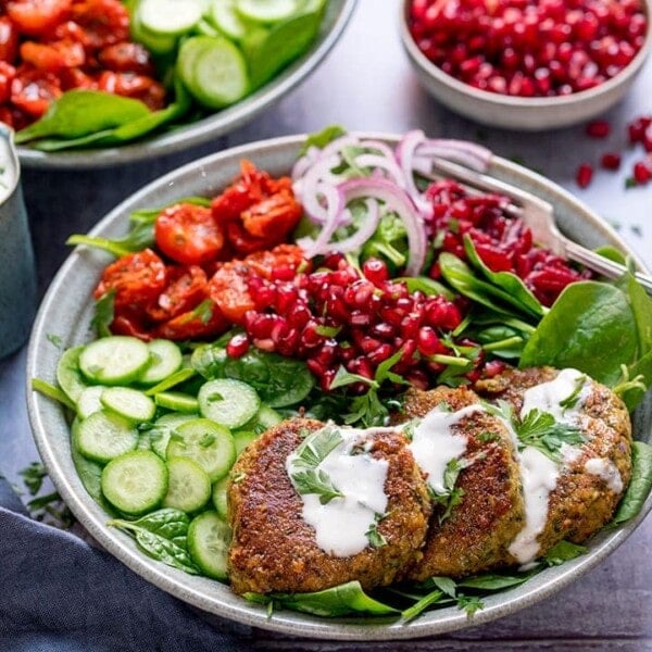 Salad bowl with falafel and feta dressing in a grey bowl