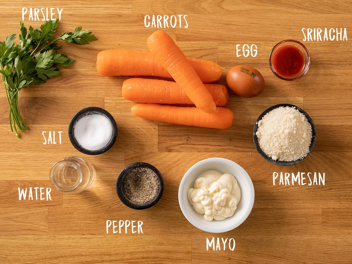 Ingredients for carrot fries on a wooden table