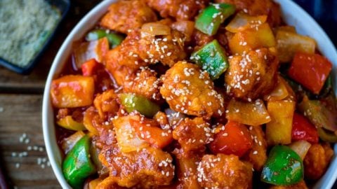 Sweet and sour chicken in a white bowl