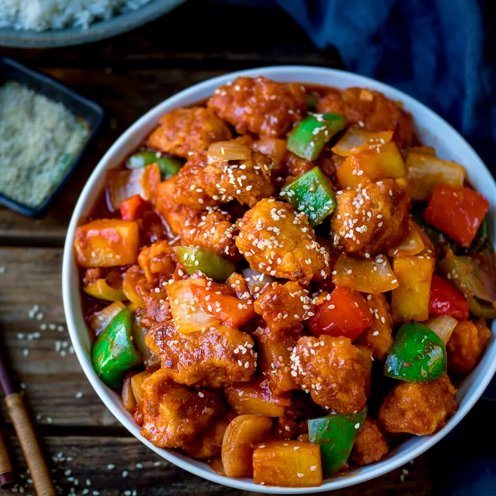 Sweet and sour chicken in a white bowl