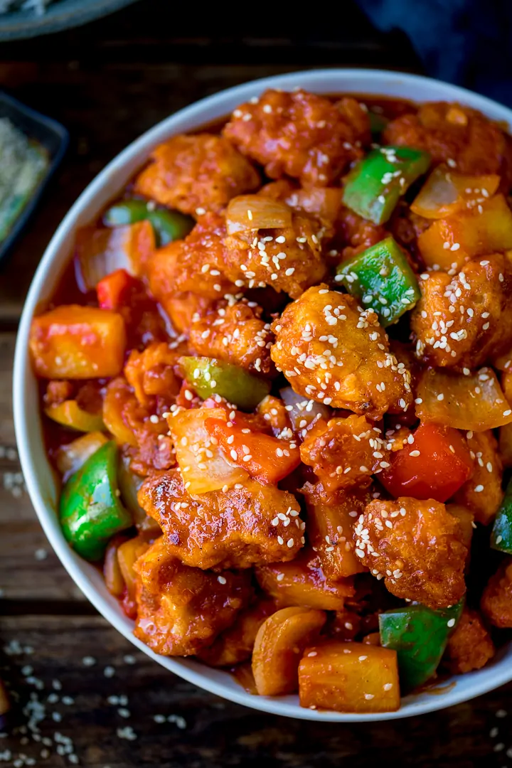 Close up of sweet and sour chicken in a bowl