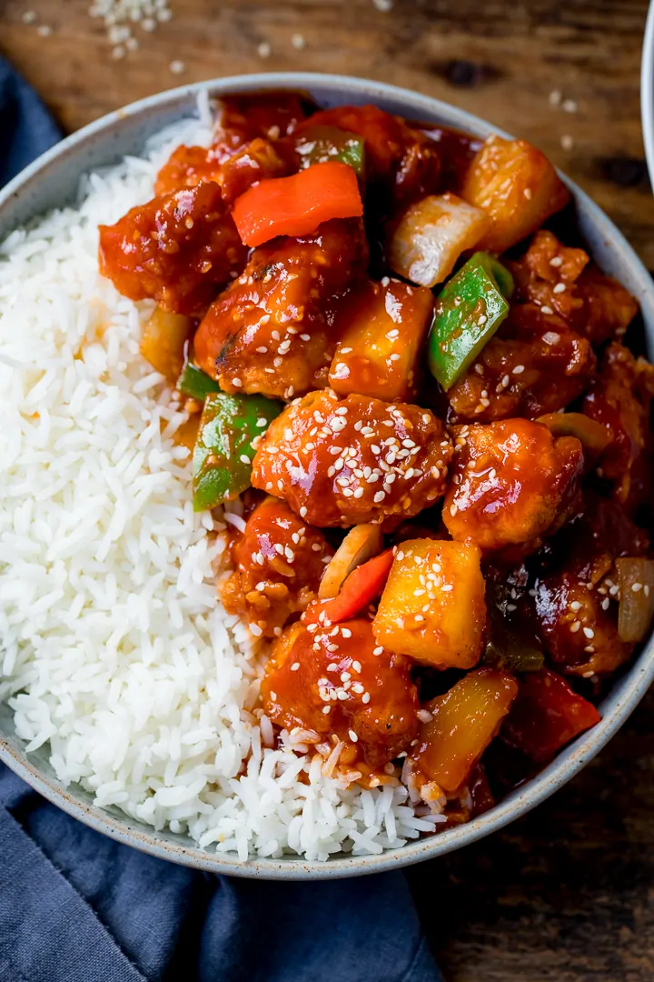 Sweet and sour chicken in a bowl with rice