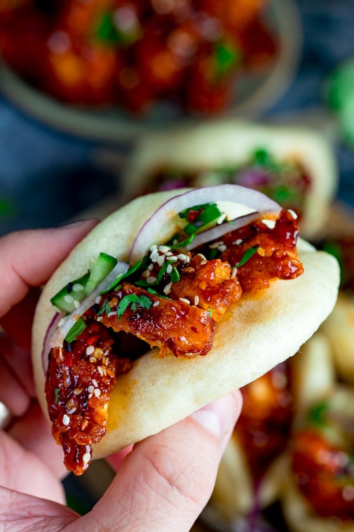 Hand holding Mini Korean chicken bao bun