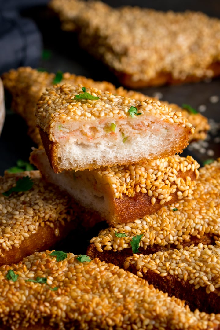 Pile of sesame prawn toast with one cut open on top