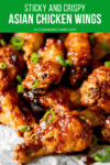 Sticky Asian Chicken Wings piled up with spring onions on top