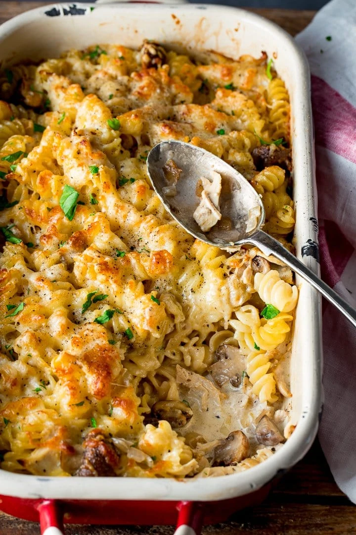 chicken alfredo pasta bake with a spoonful removed