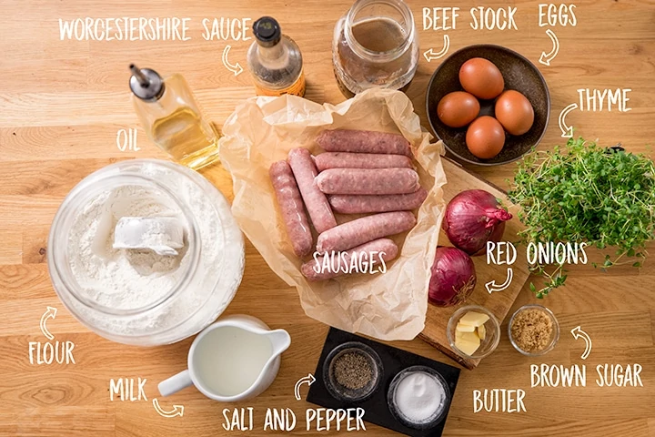 Ingredients for toad in the hole on a wooden table