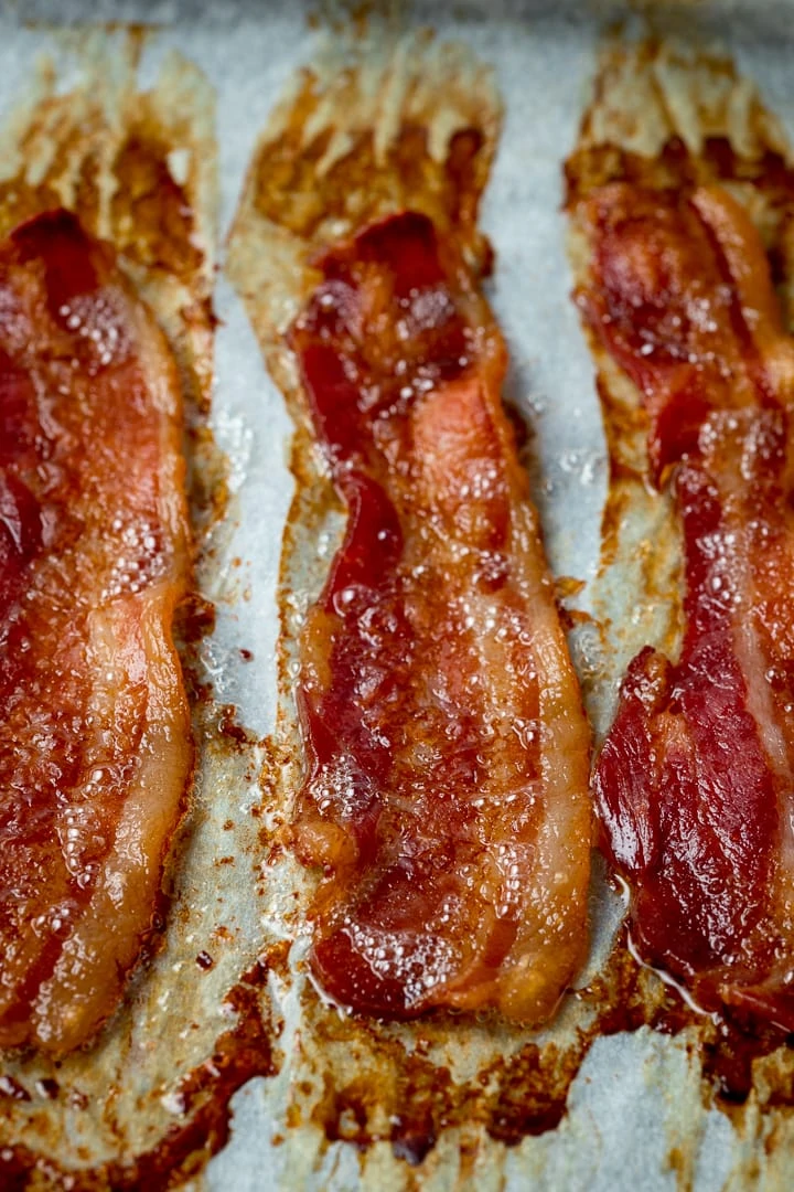 Close up of cooked bacon on a tray