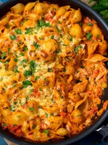 tuna pasta bake in a pan on a dark background