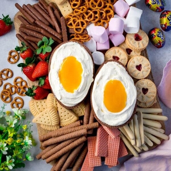 giant creme egg cheesecake dip with biscuits, fruit and marshmallows