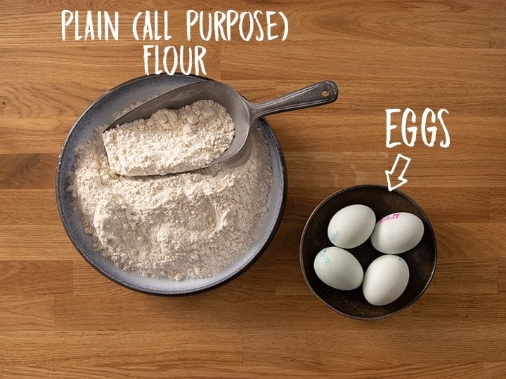 Ingredients for making homemade pasta on a wooden table