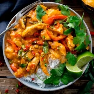 Overhead image of Thai red chicken curry with rice in a bowl